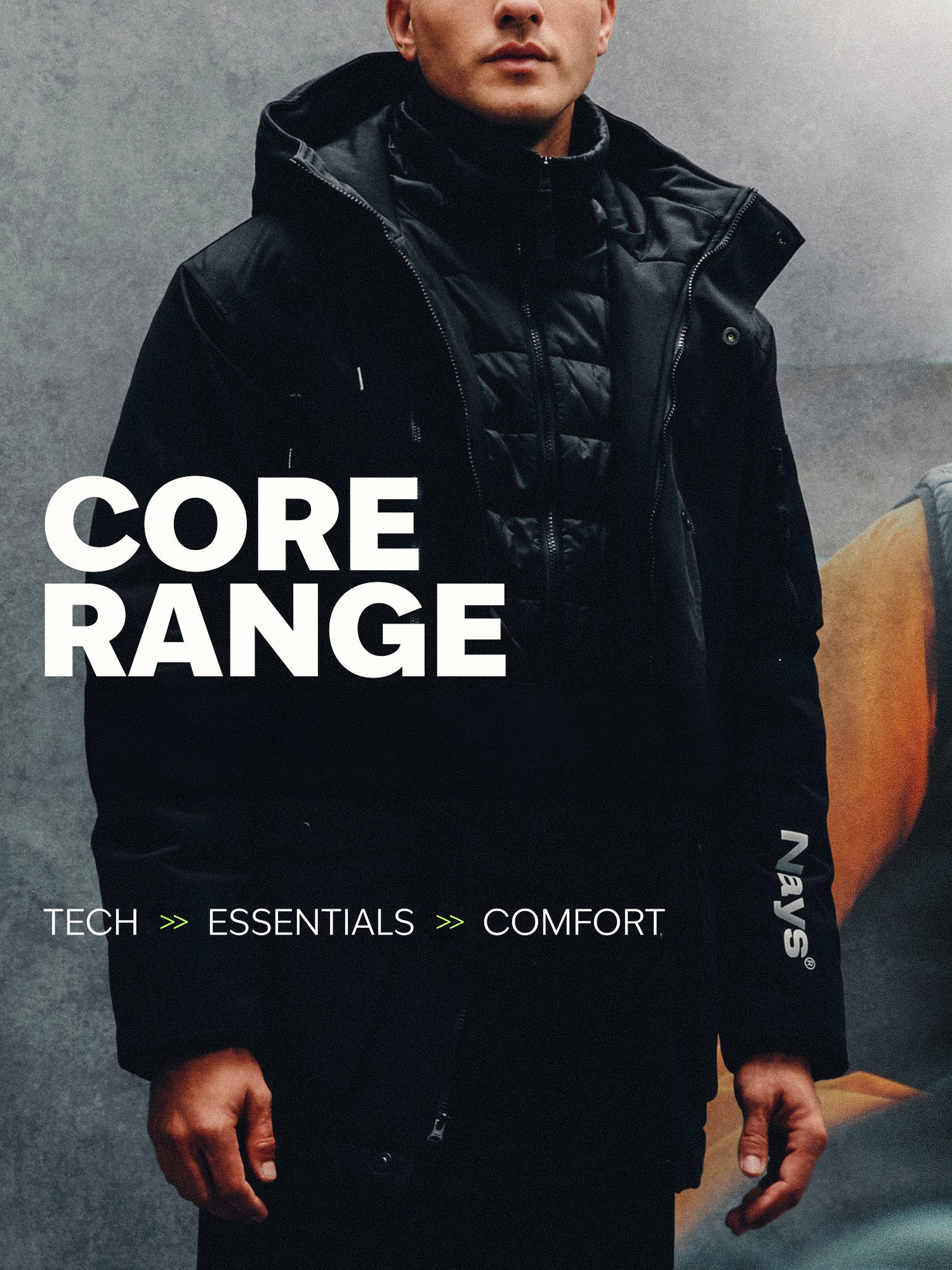 Model wearing a NAYS Parka jacket. The image introduces the NAYS Core Range, combining technical outerwear, everyday essentials and comfort-focused apparel.