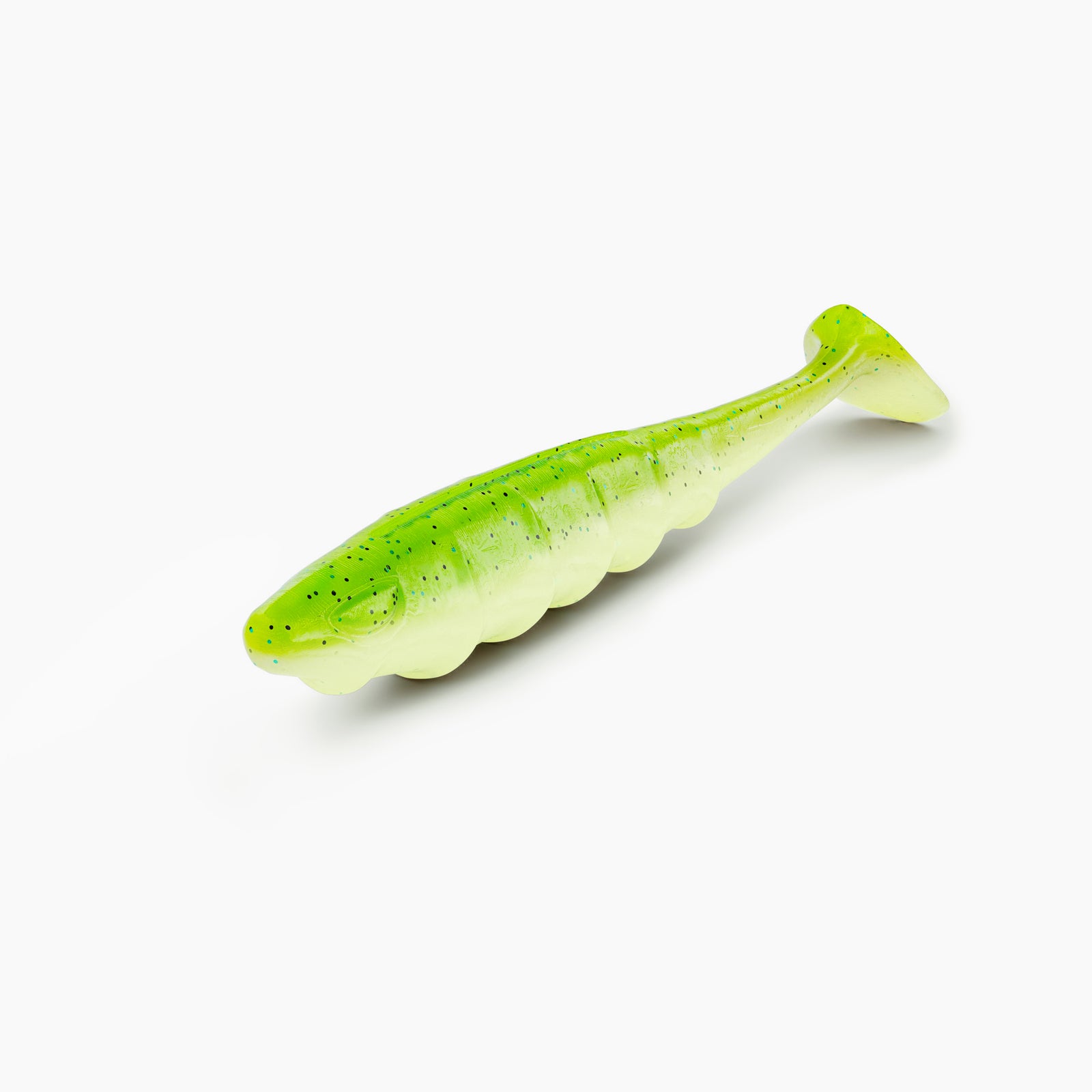 Das Bild zeigt einen Paddle-Tail-Gummiköder mit realistischem Augen-Design und typischer Rippenstruktur. Der Körper ist im grellen grün mit schwarzen Partikeln gehalten, während der Bauch einen hell-grünen Kontrast bildet.