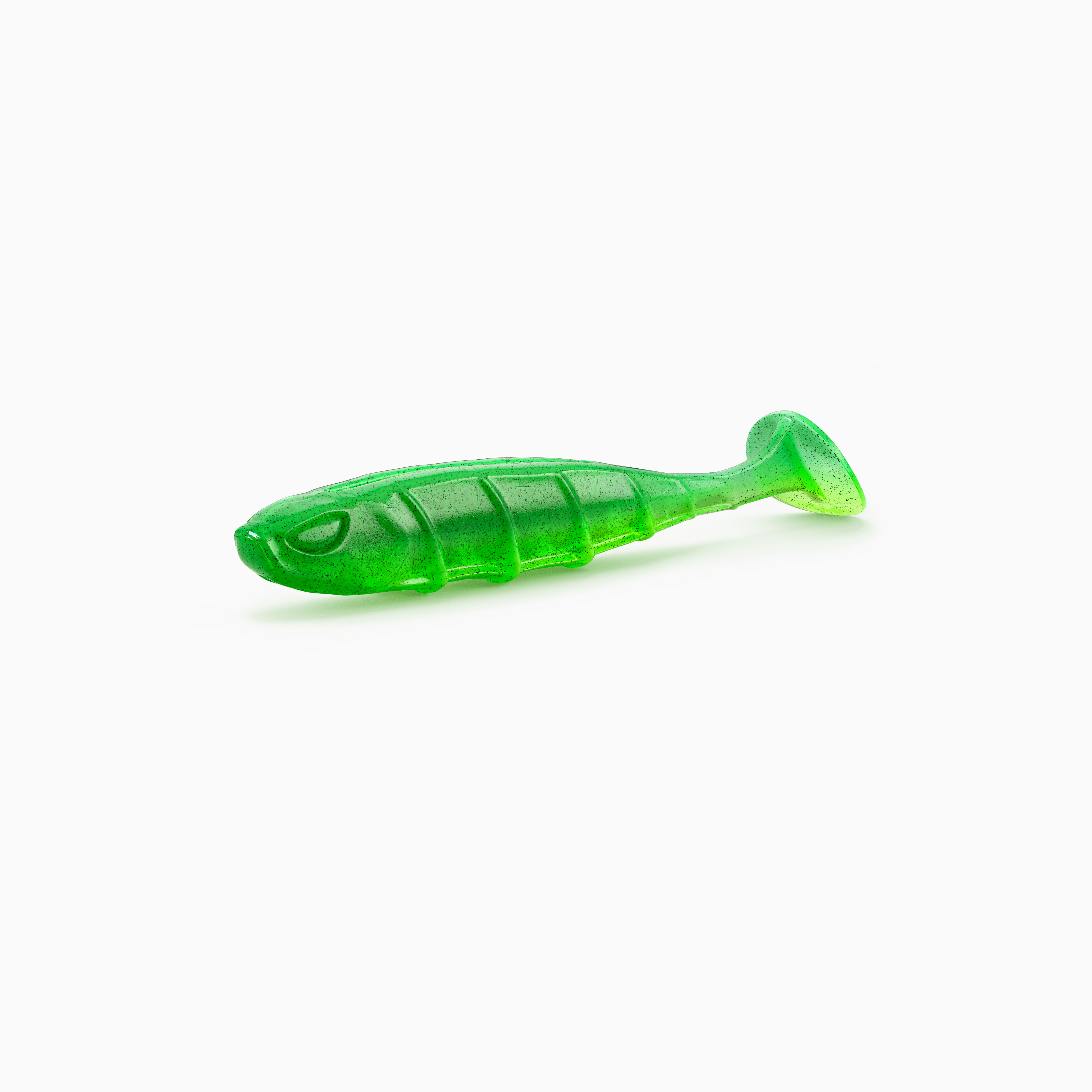 Das Bild zeigt einen Paddle-Tail-Gummiköder mit realistischem Augen-Design, typischer Rippenstruktur und schlankem Körper. Der Körper ist grell grün-gelb- Schwarze Partikel bilden einen Kontrast.